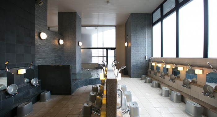 The common bathing area features a relaxed, copiously tiled space.