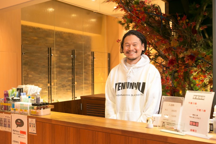 Mr. Okamura wearing an original hoodie.