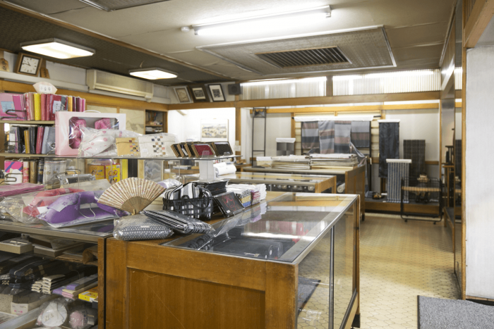 An array of kimono fabric, obi belts and kimono accessories lines the store’s shelves.