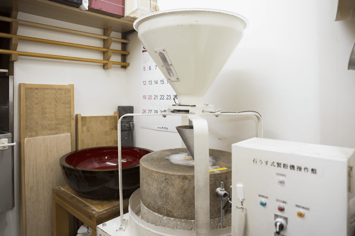 The grindstone used to grind the soba grains in the 2nd floor workshop.